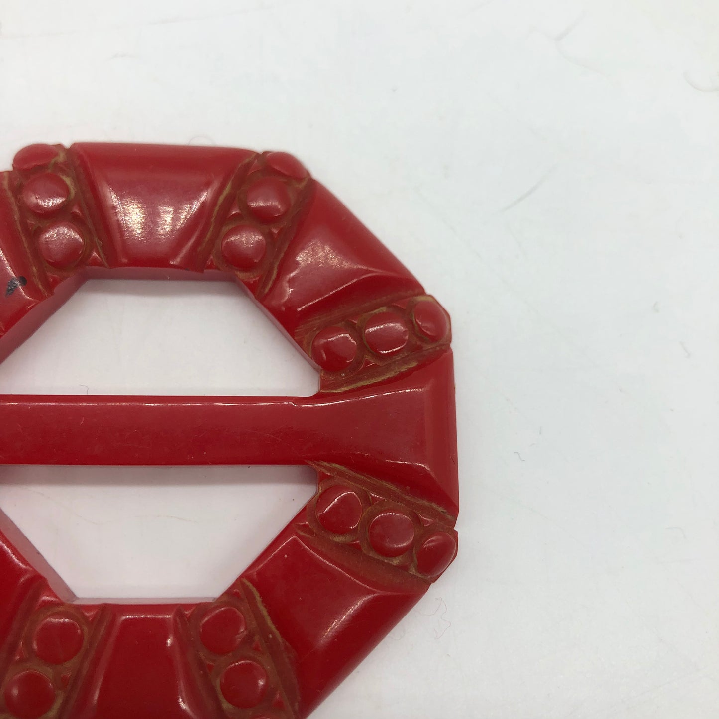 Red Carved Bakelite Buckle Scarf Holder