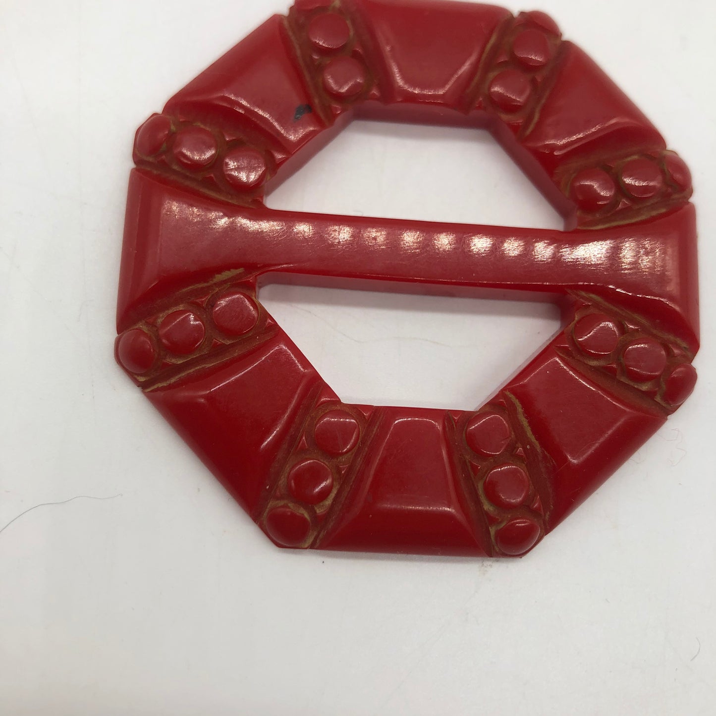 Red Carved Bakelite Buckle Scarf Holder